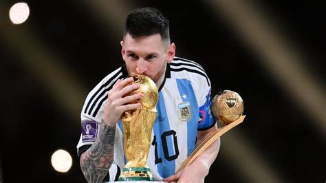 messi holding world cup trophy